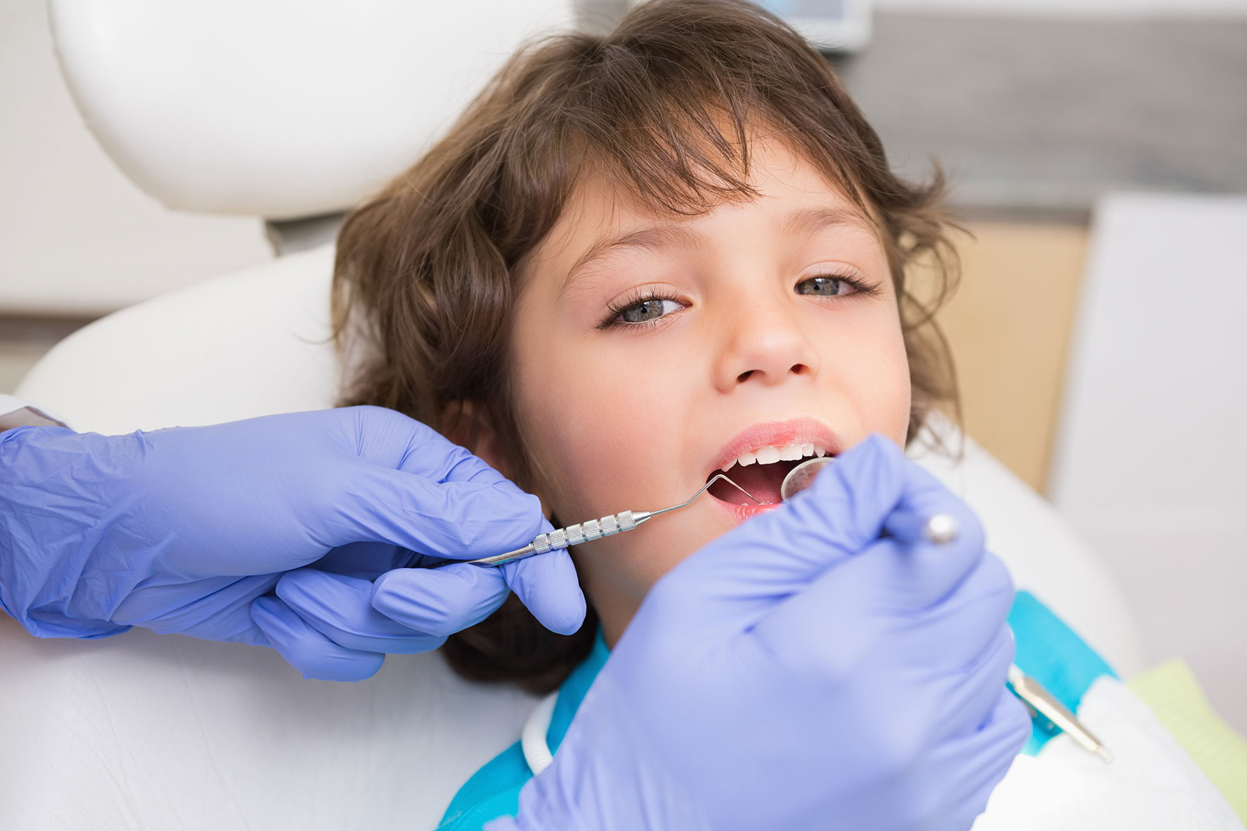 pediatric patient getting dental cleaning